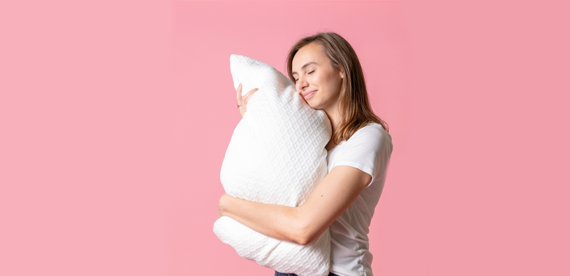 A woman hugging a pillow.