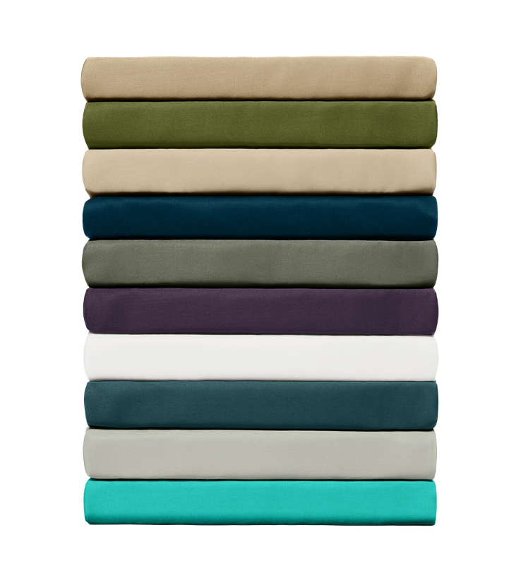 Stack of folded bamboo fitted sheets in various colors on a white background
