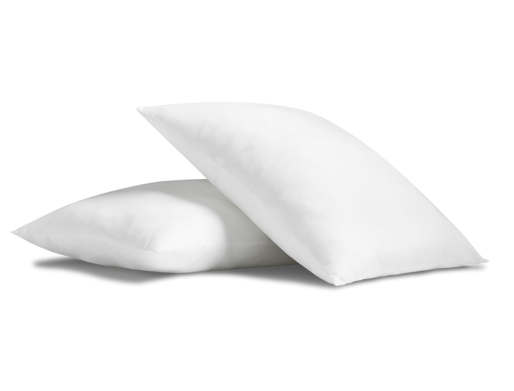 A pair of Cosy House Collection Everyday Down Alternative Pillows on a pure white backdrop, showcasing a simple and calming design.