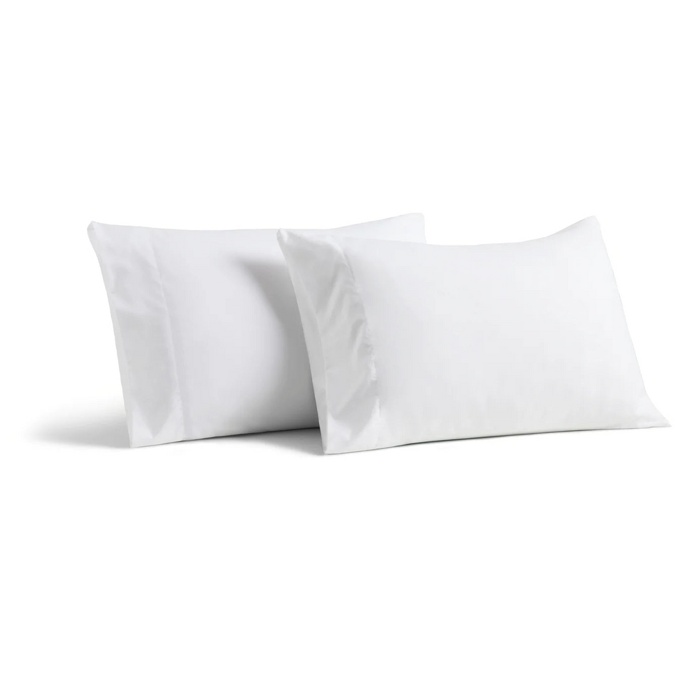 A pair of pillows covered with Luxury pillowcases.