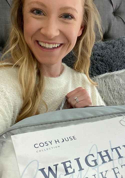 Another very happy customer showing her Weighted blanket.