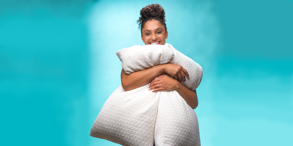 happy-woman-hugging-pillows