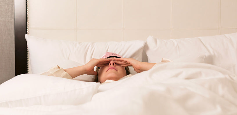 woman-in-bed-losing-sleep