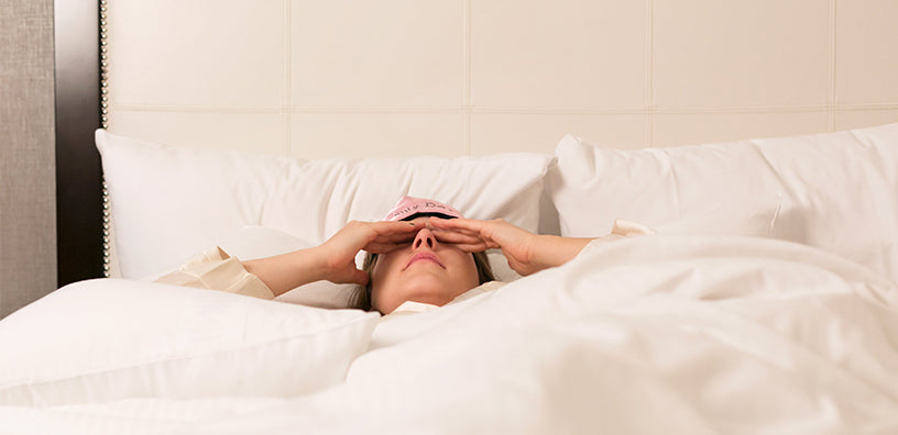 A woman is having hard time sleeping.