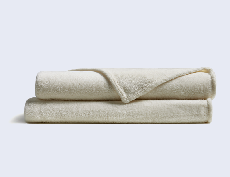A folded pair of fleece blankets.