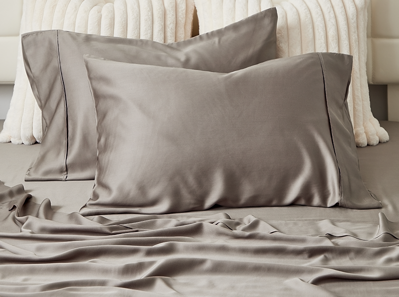 A pair of pillows covered with Cosy House Collection 100% Bamboo pillowcases.