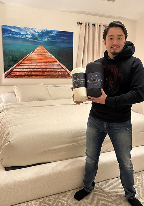A male customer showing his two new Luxury Duvet Cover sets.